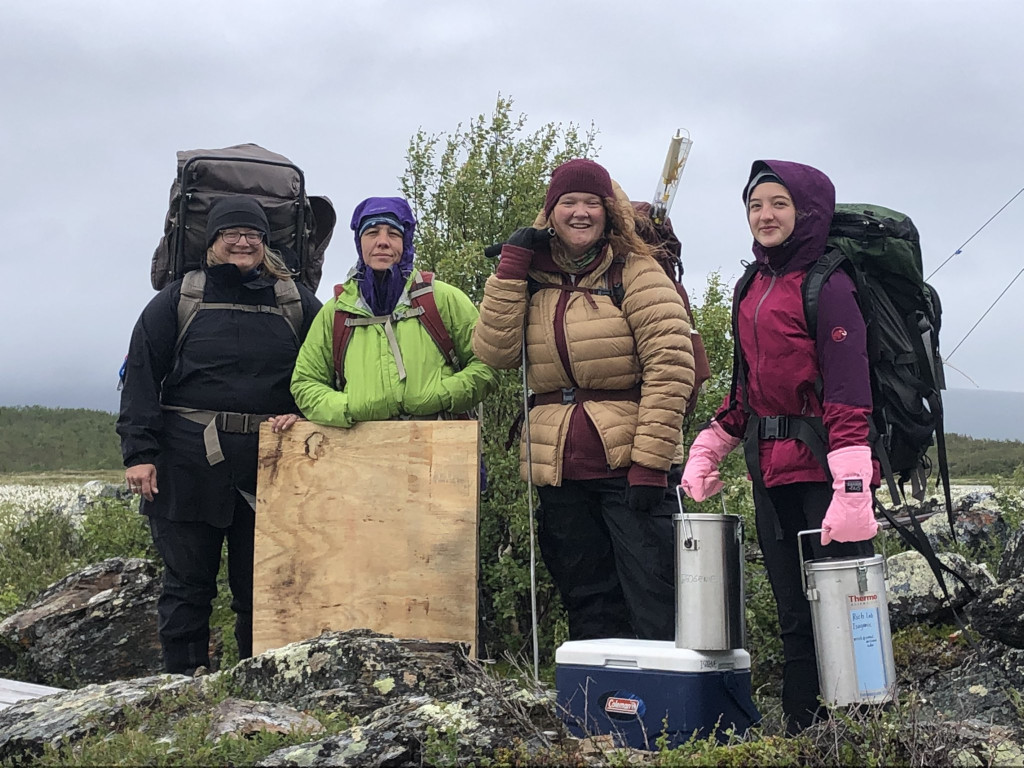 Photo of several team members in the field